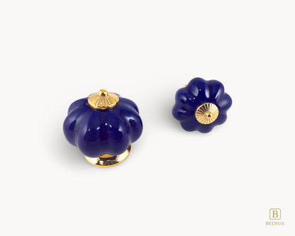 Belnua - Top and front view of Tavira porcelain cabinet knob pair with cobalt colour in pumpkin design with gold metal base