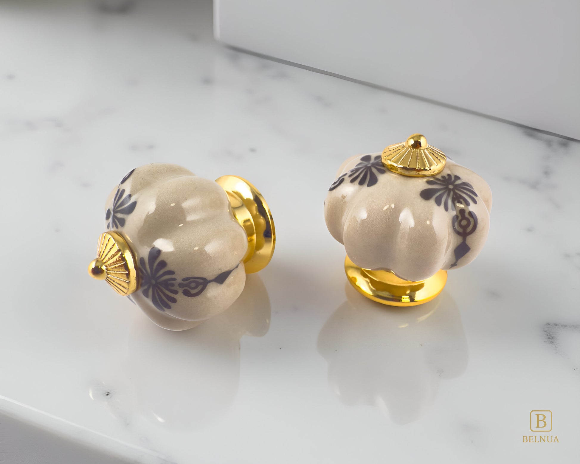 Belnua - Pair of Tavira antique brown kitchen cabinet ceramic/porcelain knob with gold base featuring golden regal wreath motif on polished marble worktop