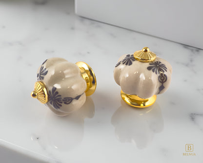 Belnua - Pair of Tavira antique brown kitchen cabinet ceramic/porcelain knob with gold base featuring golden regal wreath motif on polished marble worktop