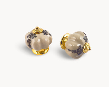 Belnua - Pair of Tavira antique brown cabinet porcelain knob with gold base featuring golden regal wreath motif. 