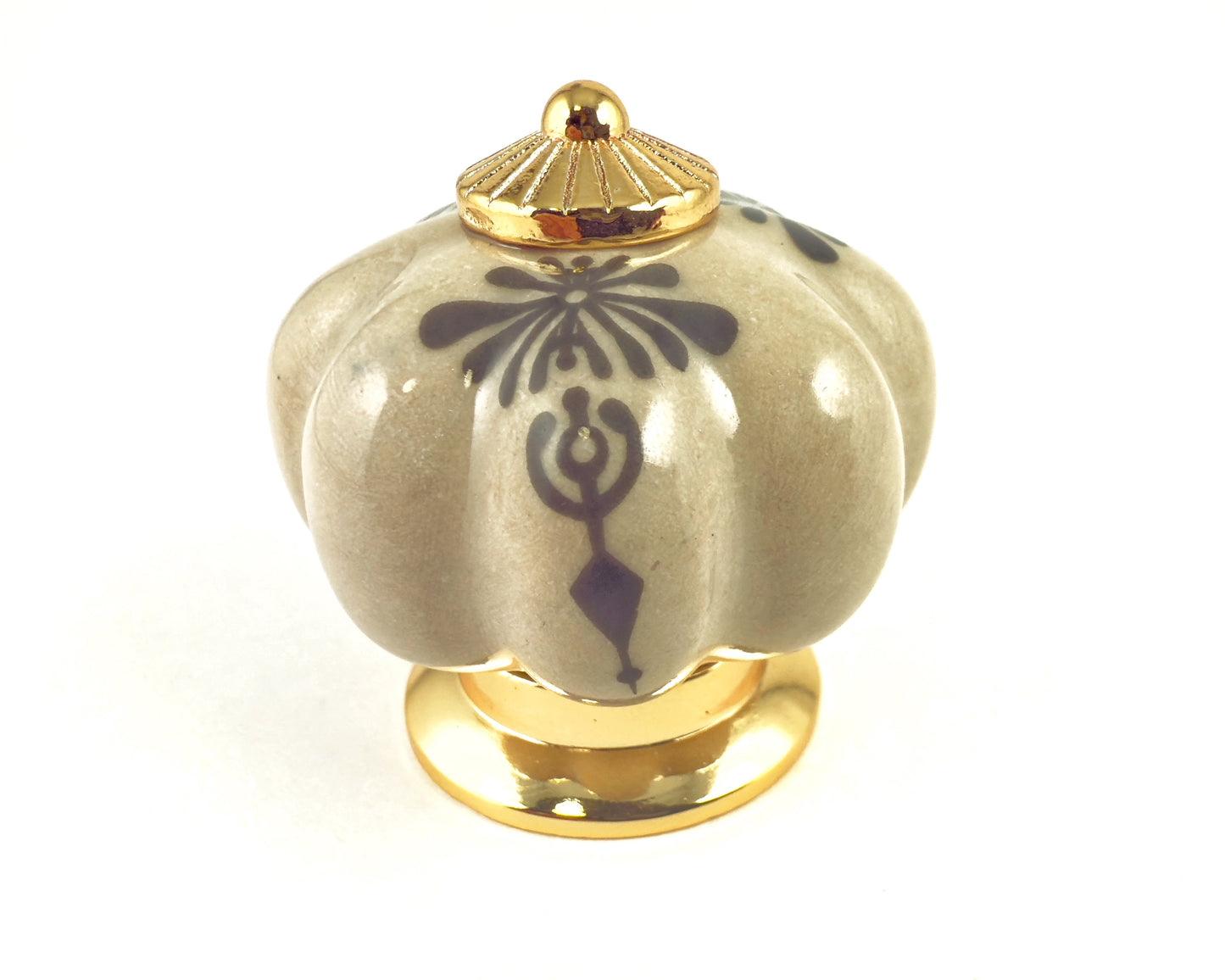 Belnua - Top close up view of a Tavira antique brown cabinet porcelain knob with gold base featuring golden regal wreath motif. 