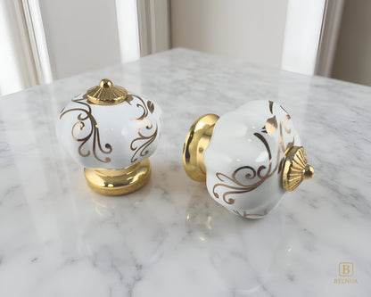 Belnua - Top and right side view of Tavira porcelain cabinet knob with gold metal base on kitchen marble worktop