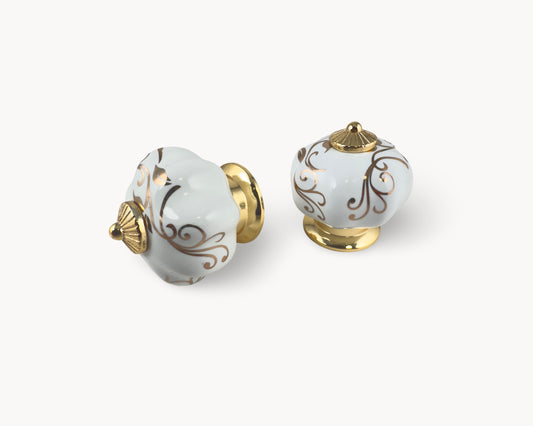 Belnua - Pair of Tavira white porcelain cabinet knob with delicate petal motif inserted on gold metal base.