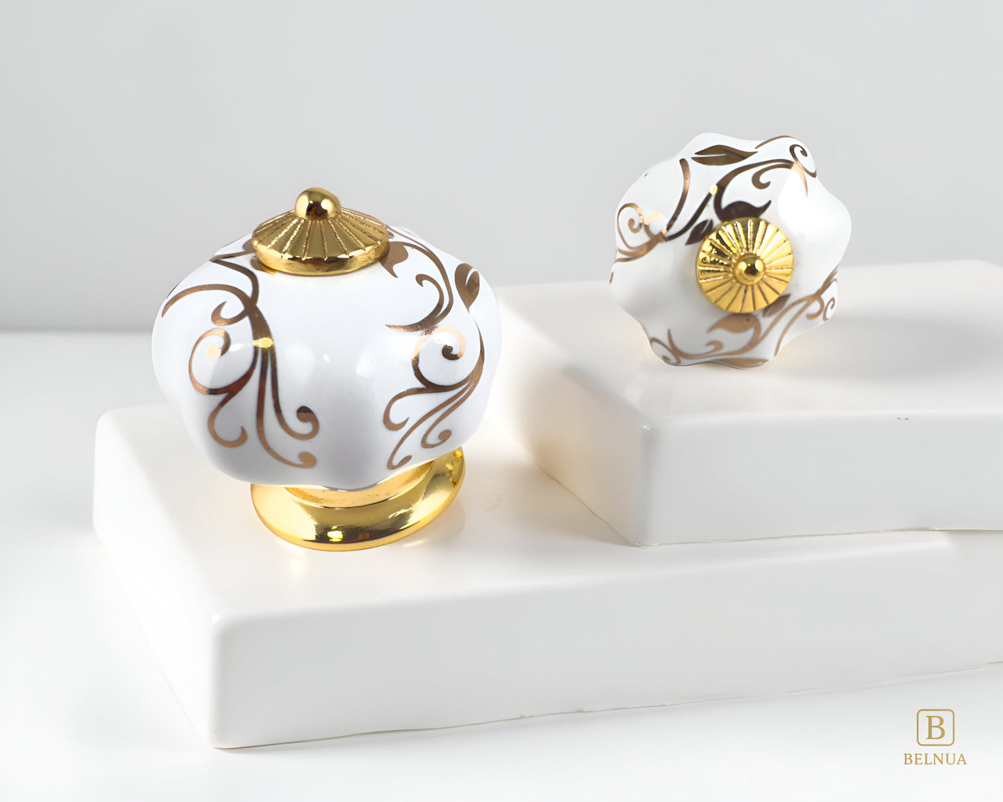 Belnua - Pair of luxury Tavira white porcelain cabinet knob with gold metal base on stepped quartz  surface
