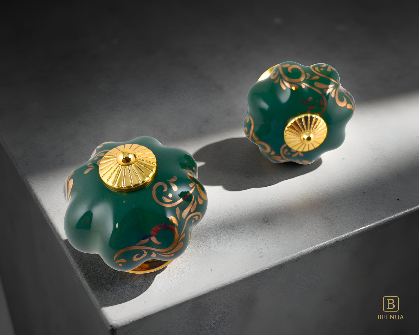 Belnua - Top and front view of luxury Tavira gold base knob with green porcelain cinsert with delicate golden vine cascade motif on grey background