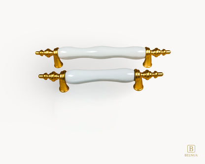 Belnua - Front top view of Velnoa matte gold cabinet handle pair with plain white porcelain/ceramic insert