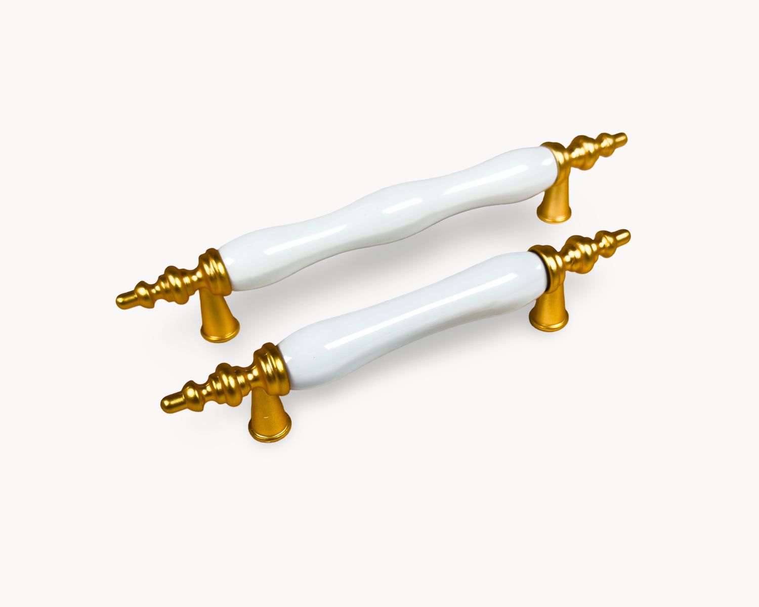 Belnua - Hero image of Velnoa matte gold cabinet handle pair with plain white porcelain/ceramic insert