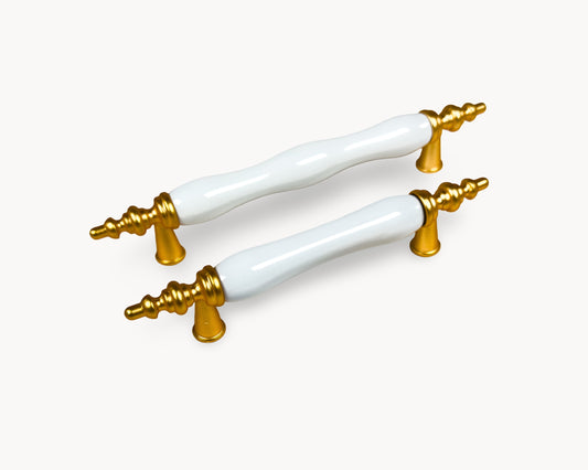 Belnua - Hero image of Velnoa matte gold cabinet handle pair with plain white porcelain/ceramic insert