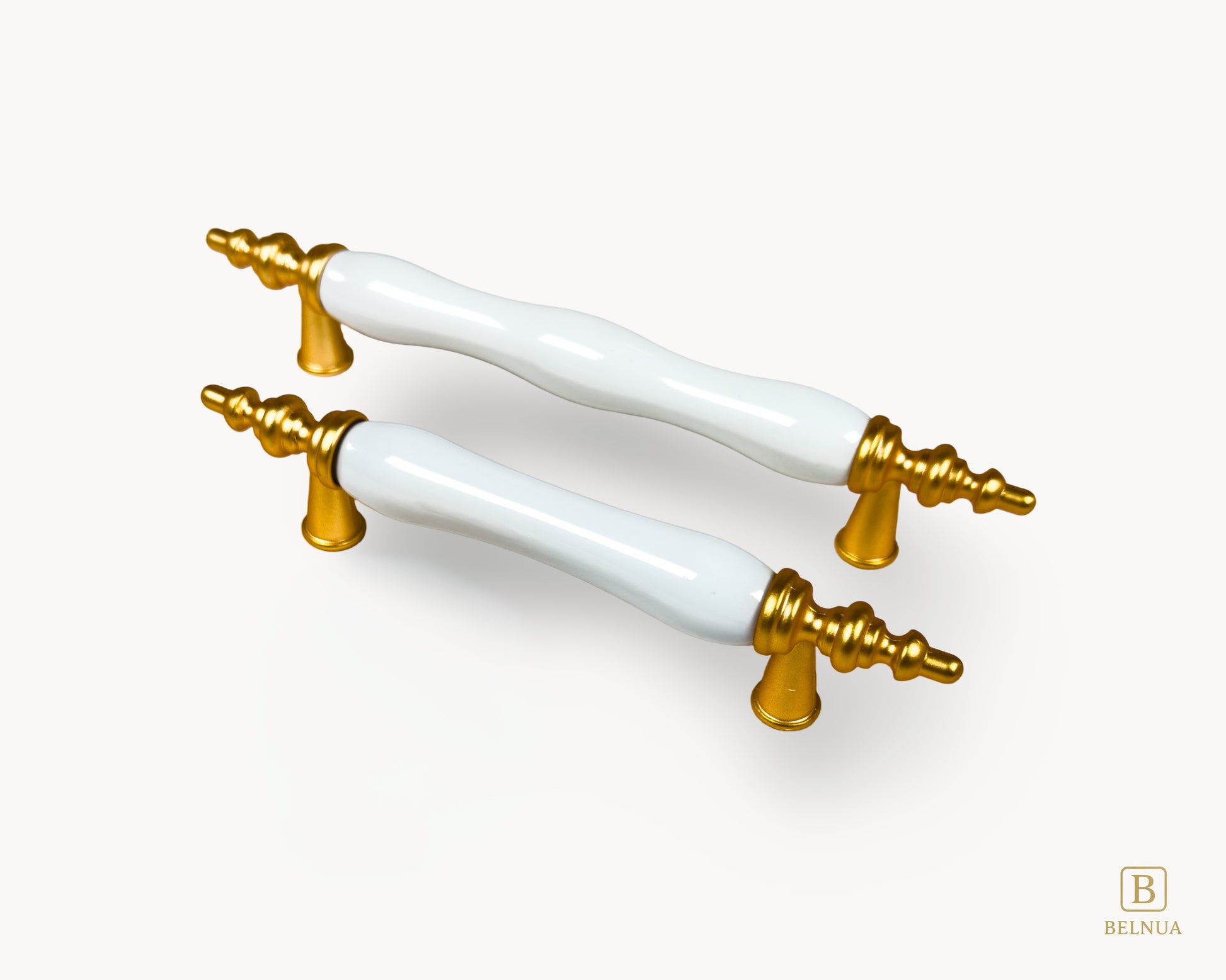 Belnua - Pair of Velnoa white ceramic handles with gold metal fixtures on a white background, with right angled view