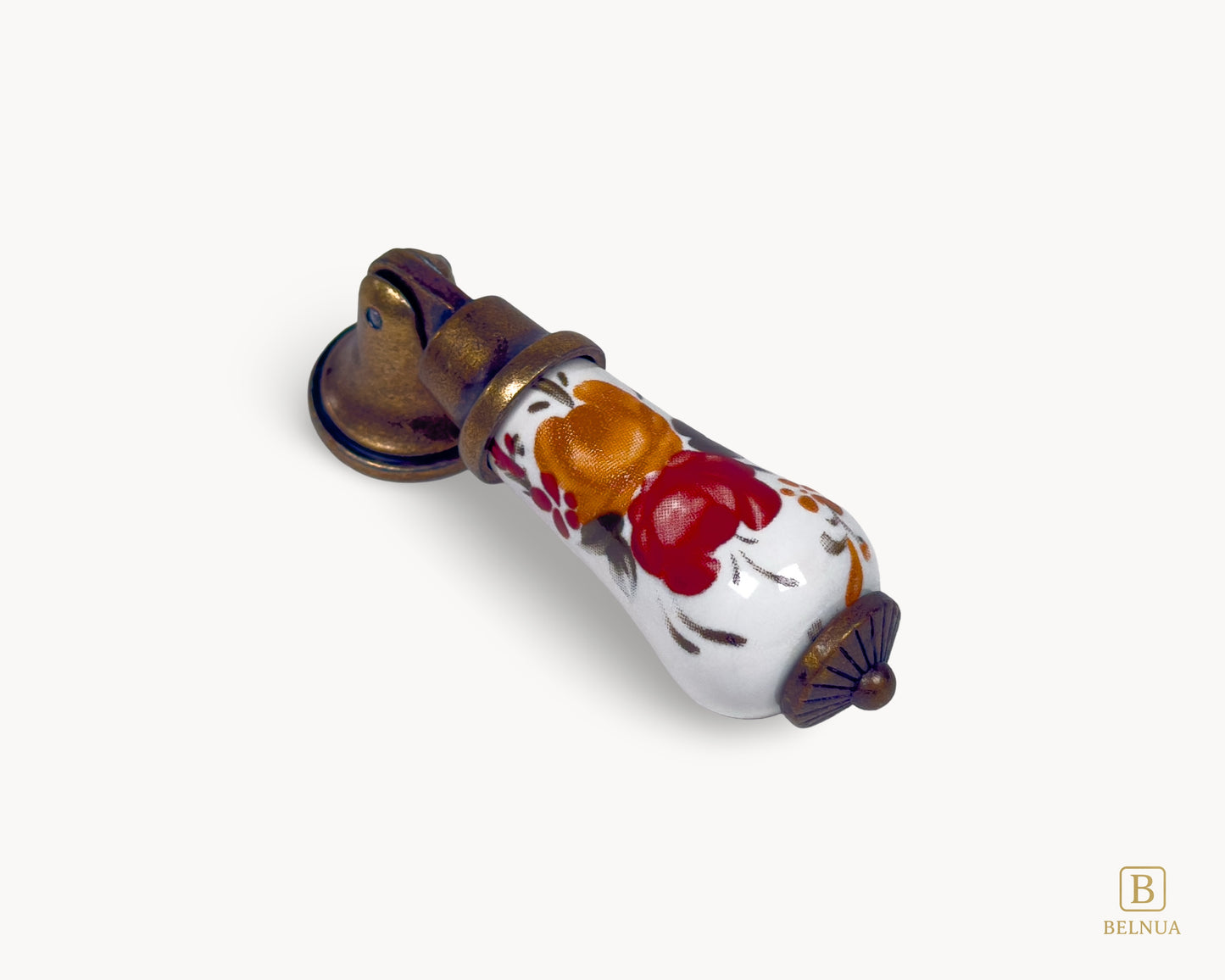 Front angled view of Verossa antique brass handle with white porcelain body and hand-painted floral motif