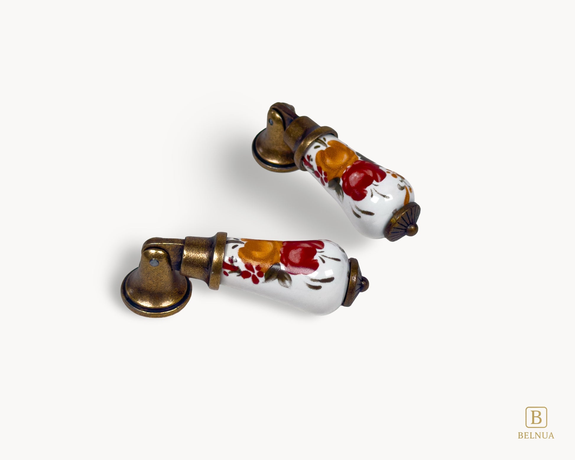 Perspective view of Verossa floral porcelain handle with antique brass base highlighting curved form