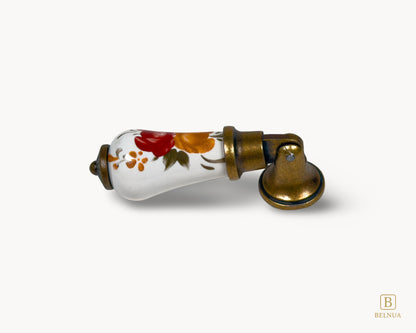 Antique brass Verossa porcelain handle with hand-painted floral pattern shown in side profile on white background