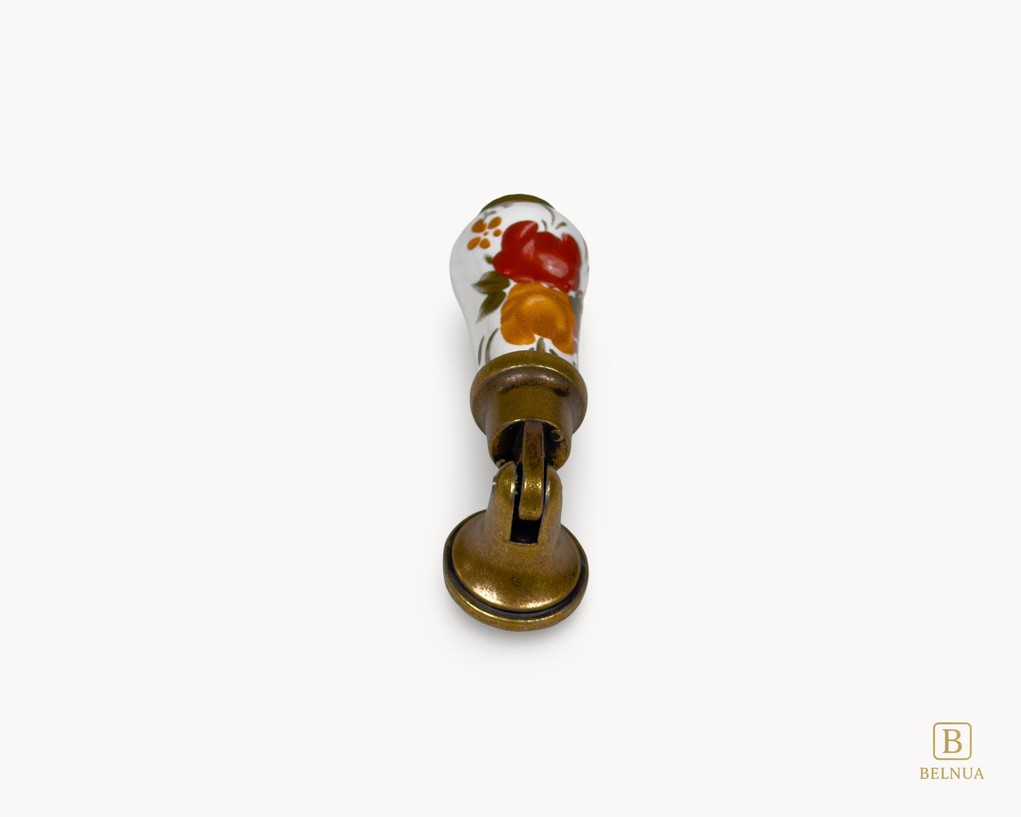 Top view of Verossa porcelain handle highlighting floral ceramic surface and antique brass mount