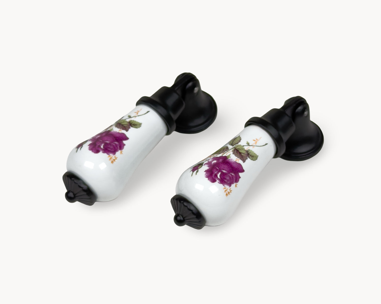 Front view of Verossa porcelain handle pair with white ceramic body, purple rose motif, and black base