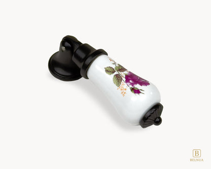 Top angle view of Verossa porcelain handle highlighting rose floral pattern and curved ceramic shape