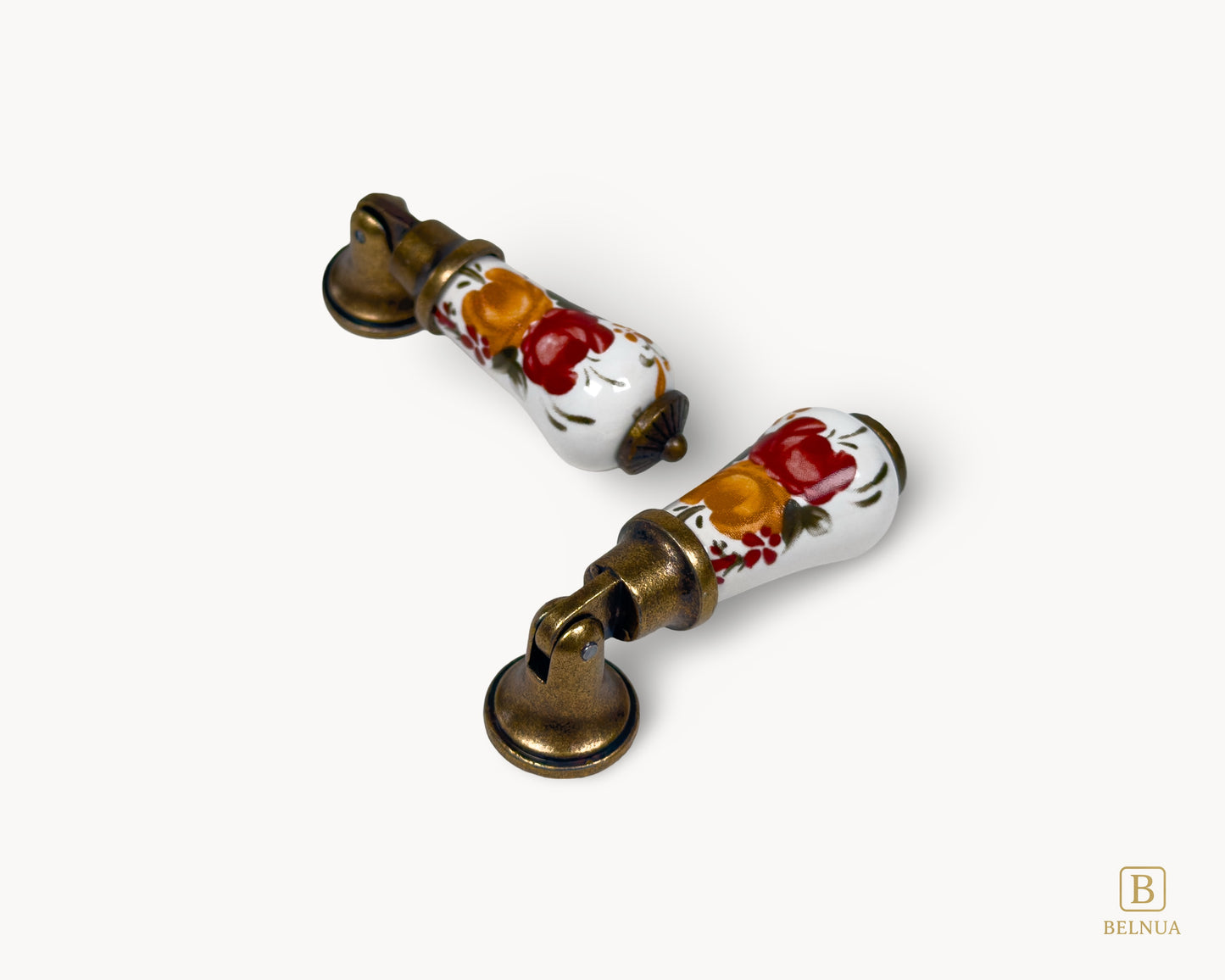 Composed pair of Verossa porcelain handles with floral ceramic design and antique brass hardware