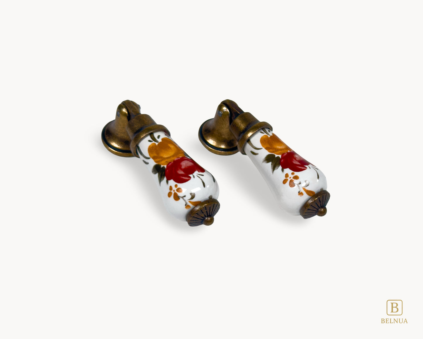 Wide composition of two Verossa porcelain handles showing floral ceramic bodies and brass mounts