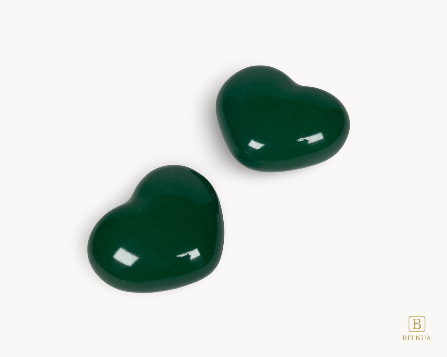 Close-up of glossy dark green porcelain finish on Belnua Veyla heart knob