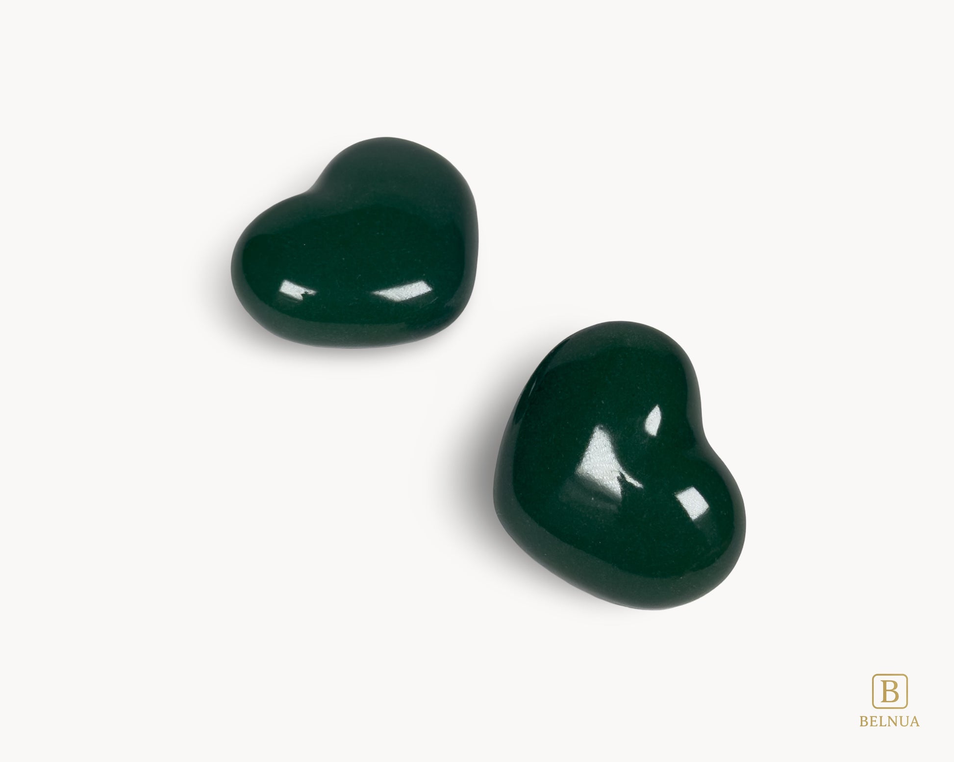 Detail view of handcrafted Belnua Veyla dark green porcelain heart knob