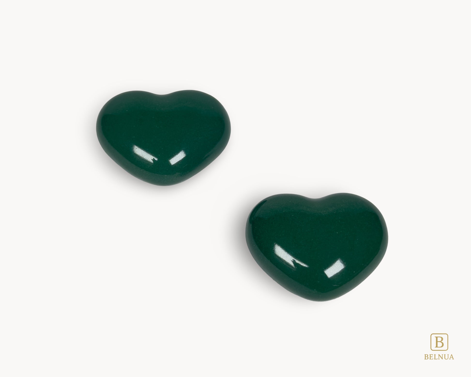 Angled view of Belnua Veyla dark green porcelain heart-shaped knob