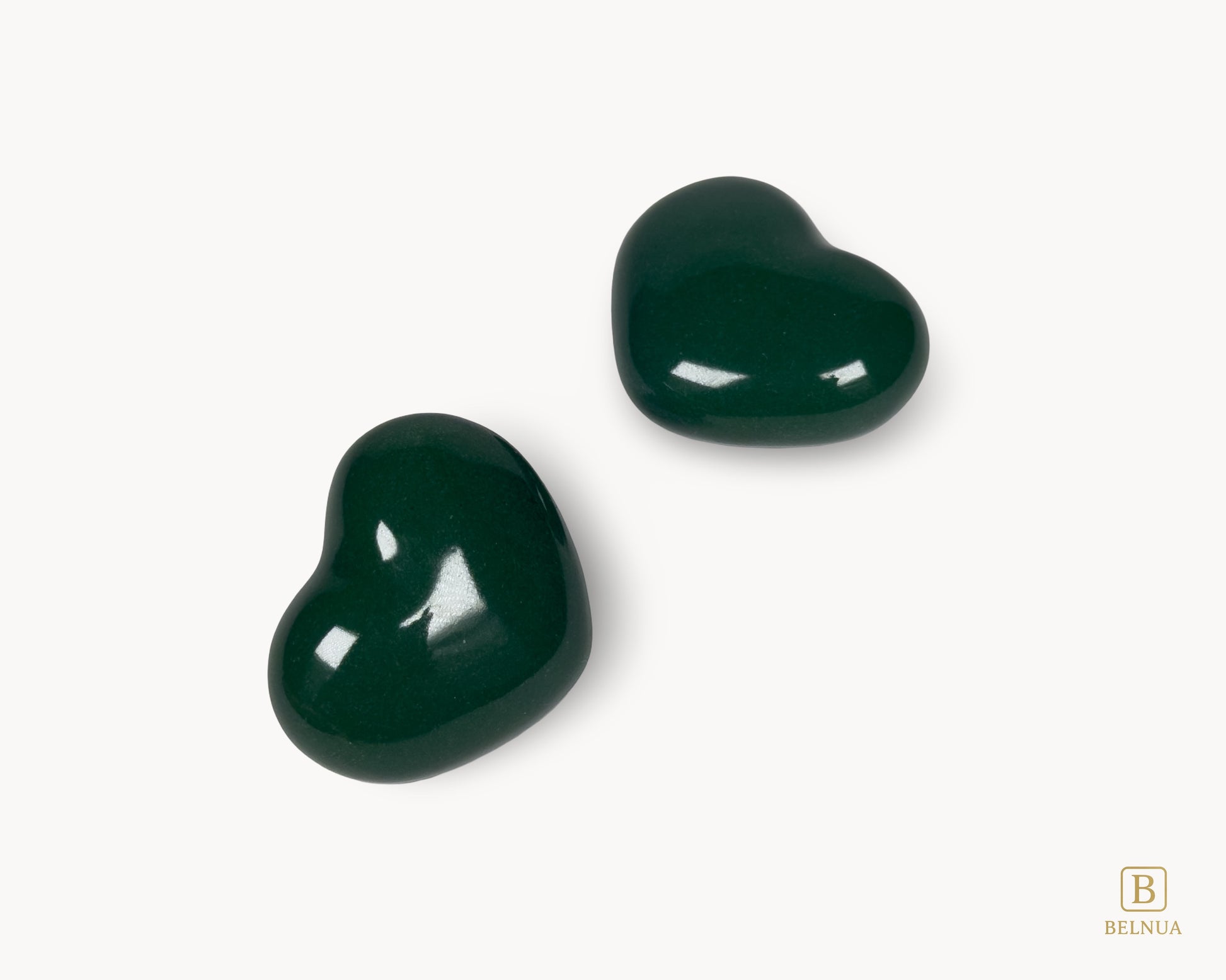 Studio photograph of Belnua Veyla dark green porcelain heart knob