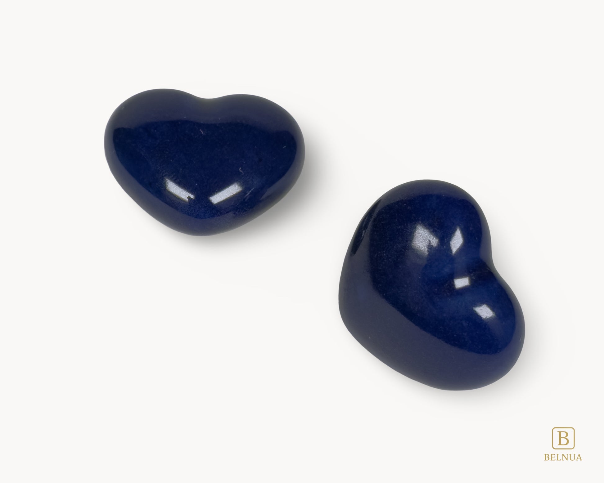Angled right view of Belnua Veyla cobalt blue heart porcelain knob with glossy finish