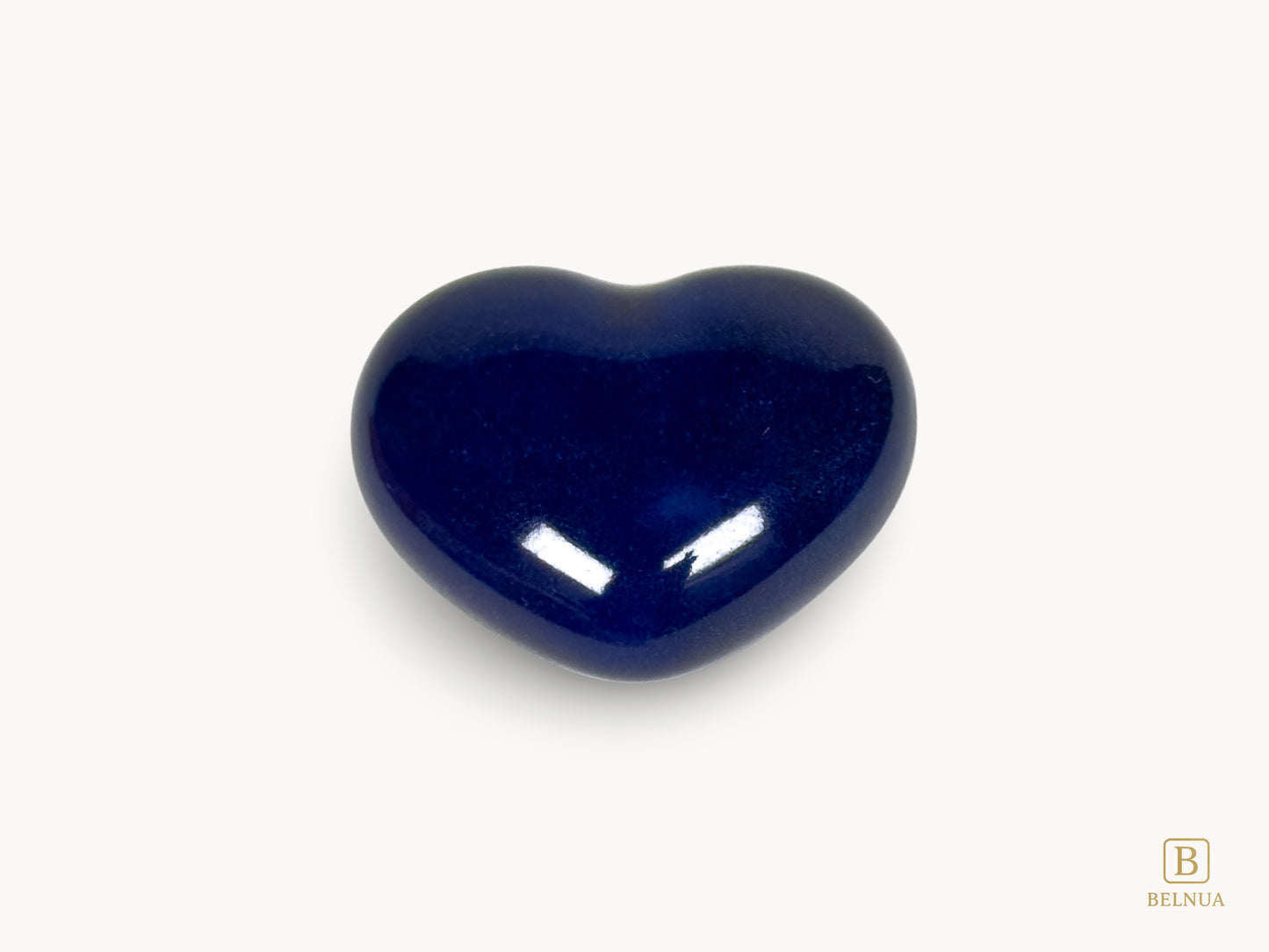 Belnua Veyla heart-shaped porcelain knob in cobalt blue, single knob front view on porcelain white background