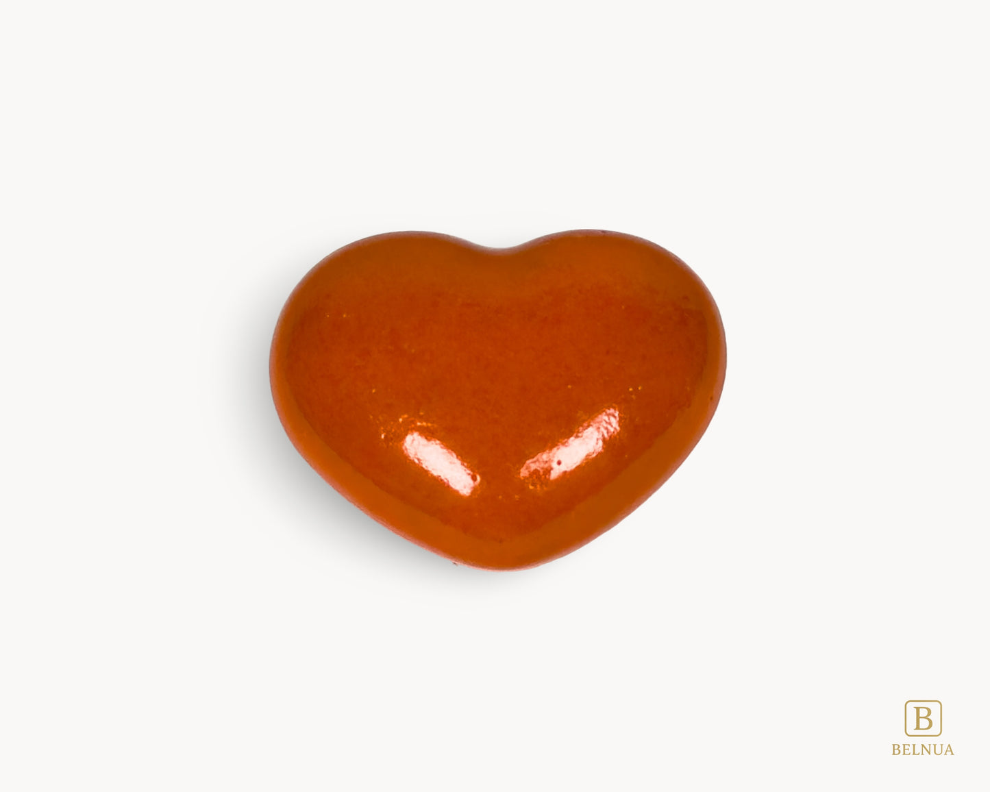 Belnua Veyla orange heart-shaped porcelain cabinet knob, front view