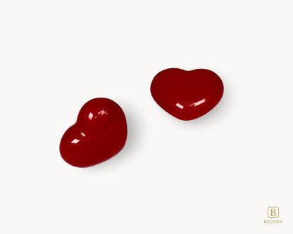 Close-up of Belnua Veyla red porcelain heart knob glossy finish
