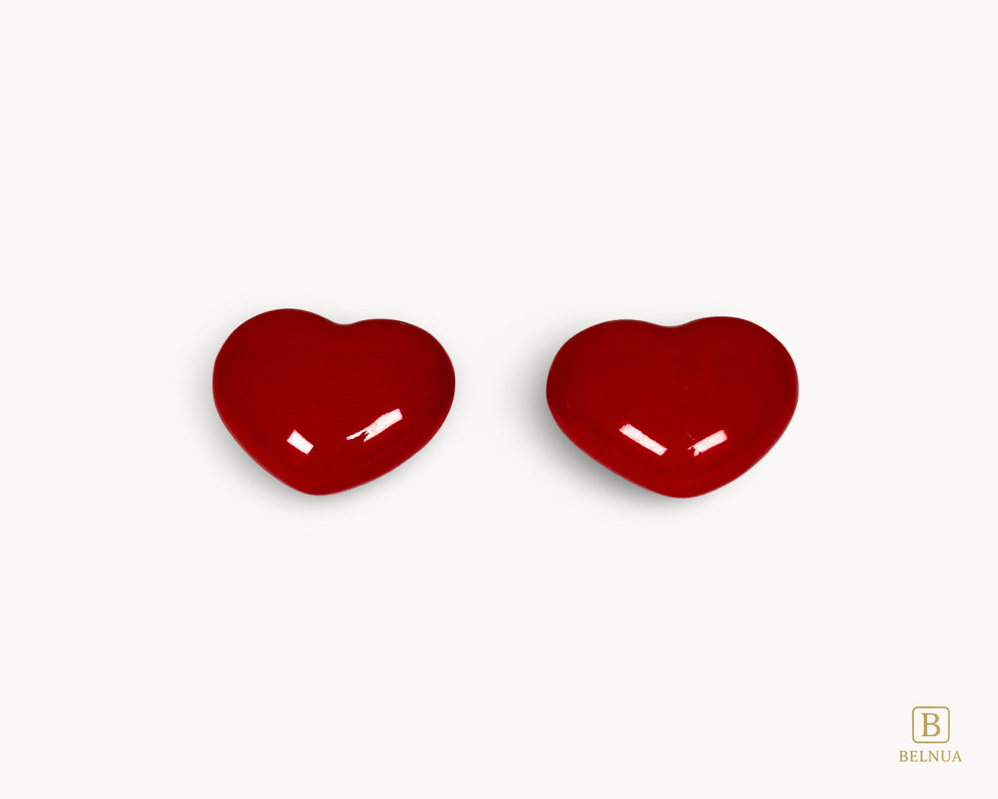 Side profile of Belnua Veyla red porcelain heart knob highlighting depth