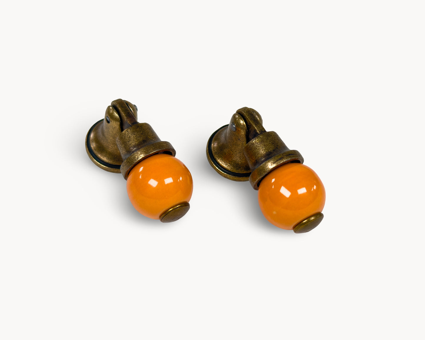 Belnua - VIRELLA knob pair in antique brass finish with smooth orange porcelain