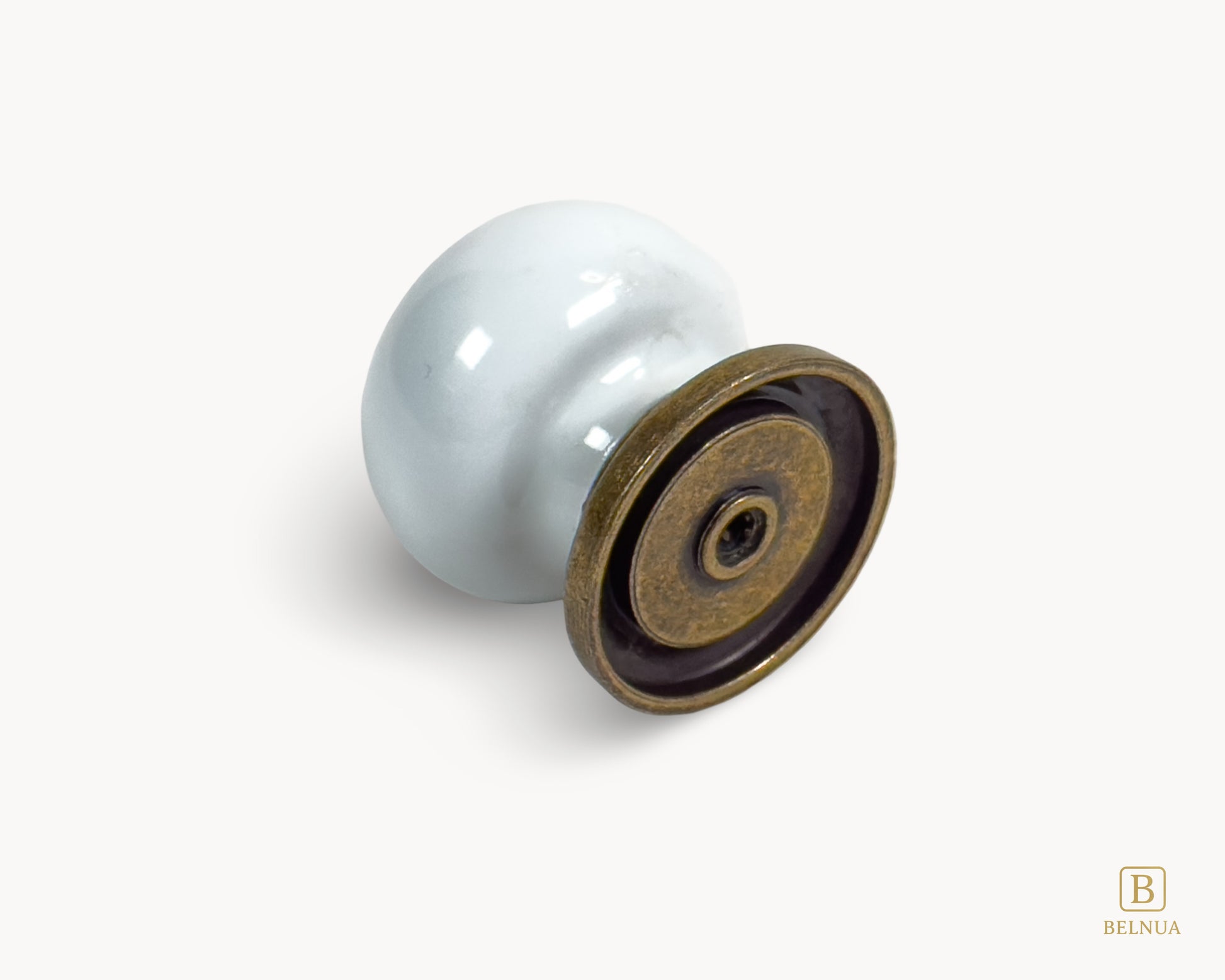 Belnua - Detail back view of ZERRA cabinet knob with white ceramic/porcelain on antique brass base