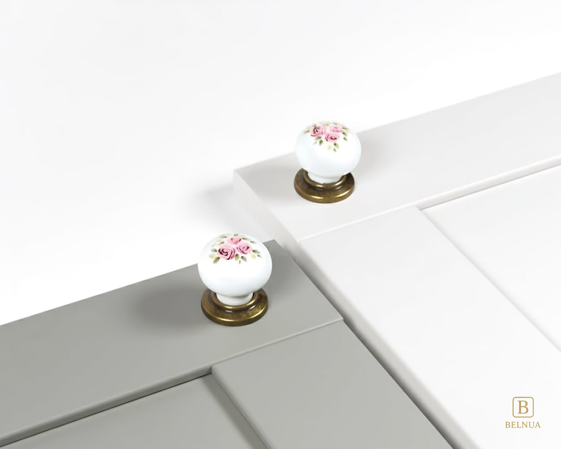 Belnua - Antique brass base ZERRA porcelain/ceramic white knob with Wildflower Garden design on sage green and dove grey cabinet door showcase