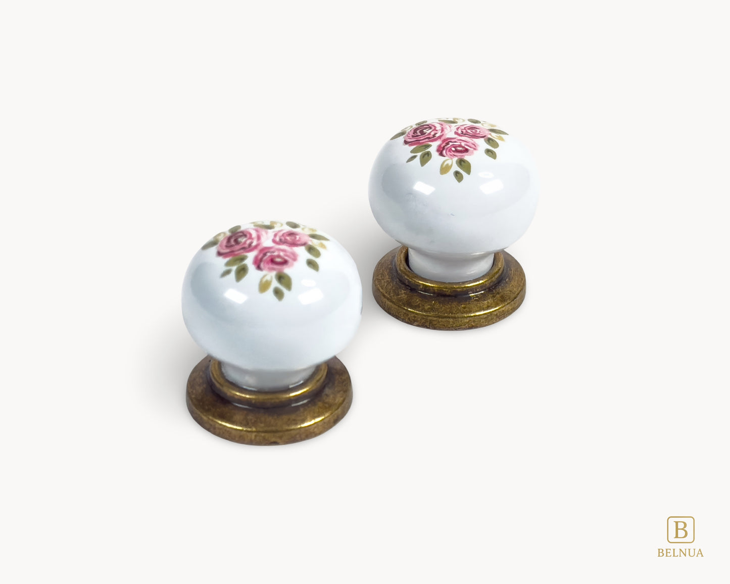Belnua - Top view of delicate ZERRA porcelain/ceramic white knob pair in vintage style antique brass finish with Wildflower Garden design