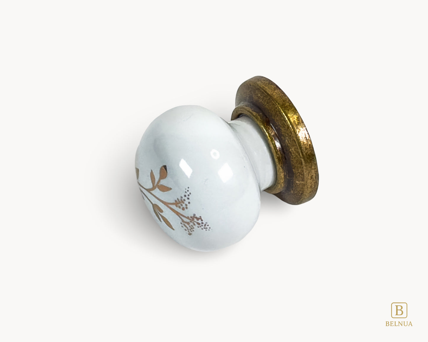 Left side view of Zerra decorative ceramic/porcelain knob with brass base and earth brown floral design | Belnua
