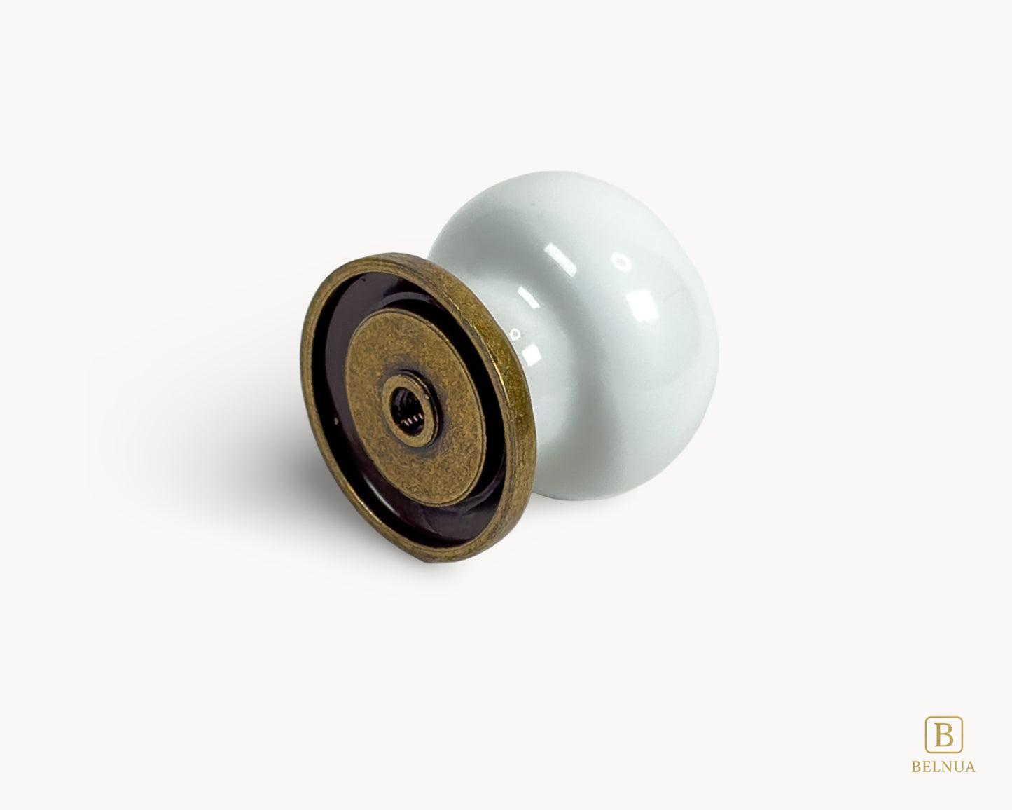 Back angled view of Zerra decorative ceramic/porcelain knob with brass base | Belnua