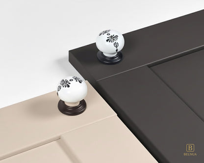 Belnua - ZERRA black and white porcelain knob with midnight blossom motif on cashmere and charcoal grey cabinet door