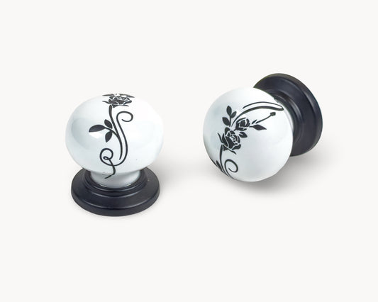 Belnua - ZERRA knob with black botanical motif on white porcelain and matte black base