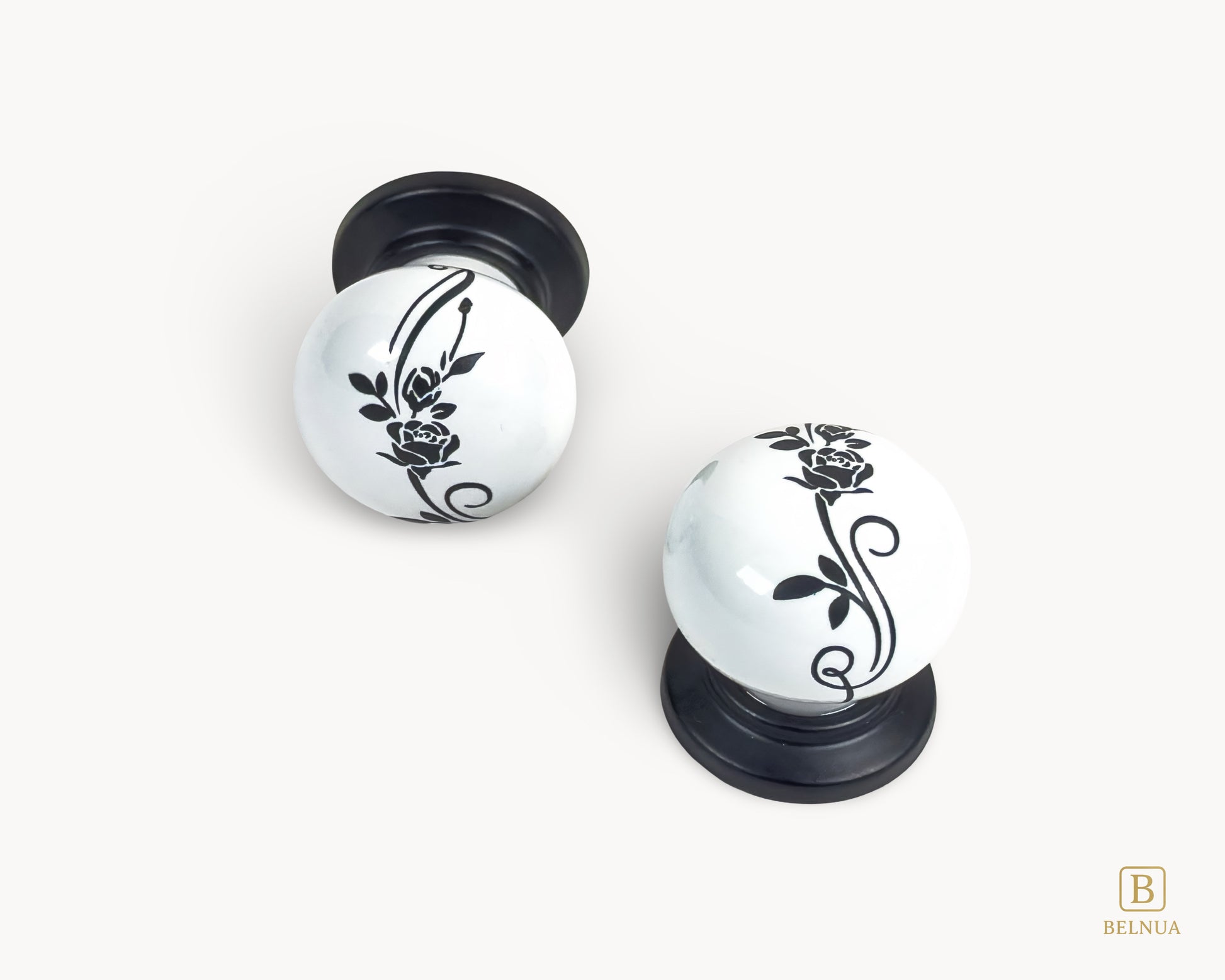 Belnua - Close up top and front view of ZERRA white ceramic/porcelain knob showing floral design with matte black base