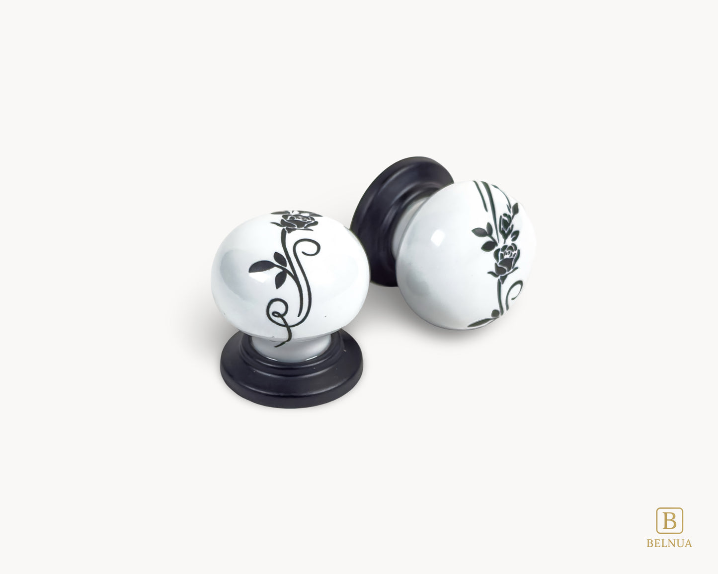 Belnua - Close up top and right flat lay view of ZERRA white ceramic/porcelain knob showing floral design with matte black base