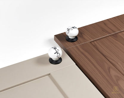 Belnua - ZERRA porcelain/ceramic white knob with botanical motif on black base showcasing with light taupe & walnut cabinet door