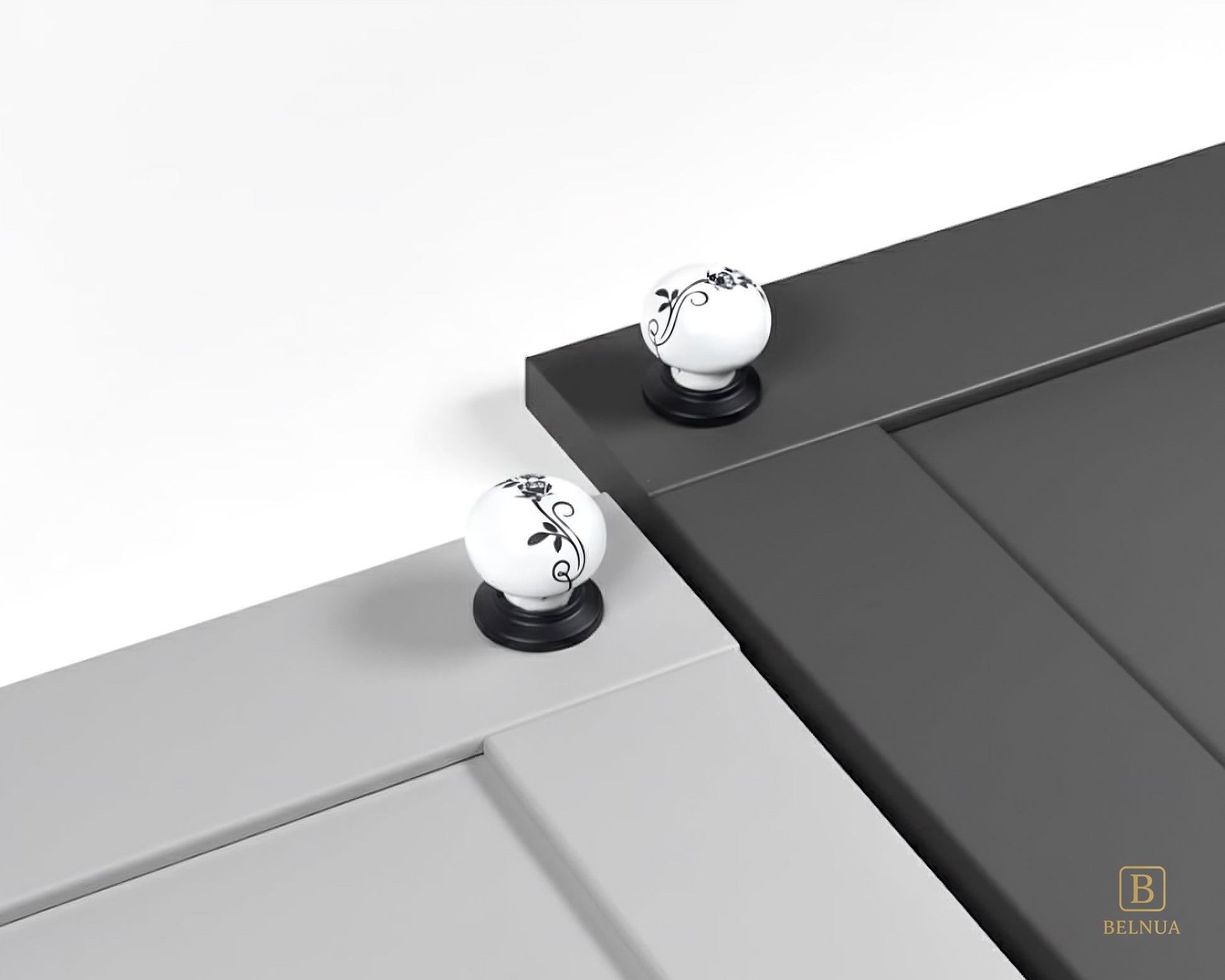 Belnua - ZERRA porcelain/ceramic white knob with botanical motif on black base showcasing with light & charcoal grey cabinet door