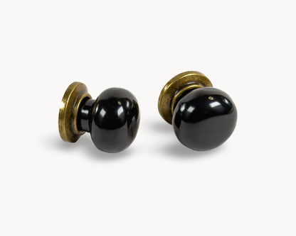 Pair of Zerra porcelain black cabinet knobs with brass accents | Belnua