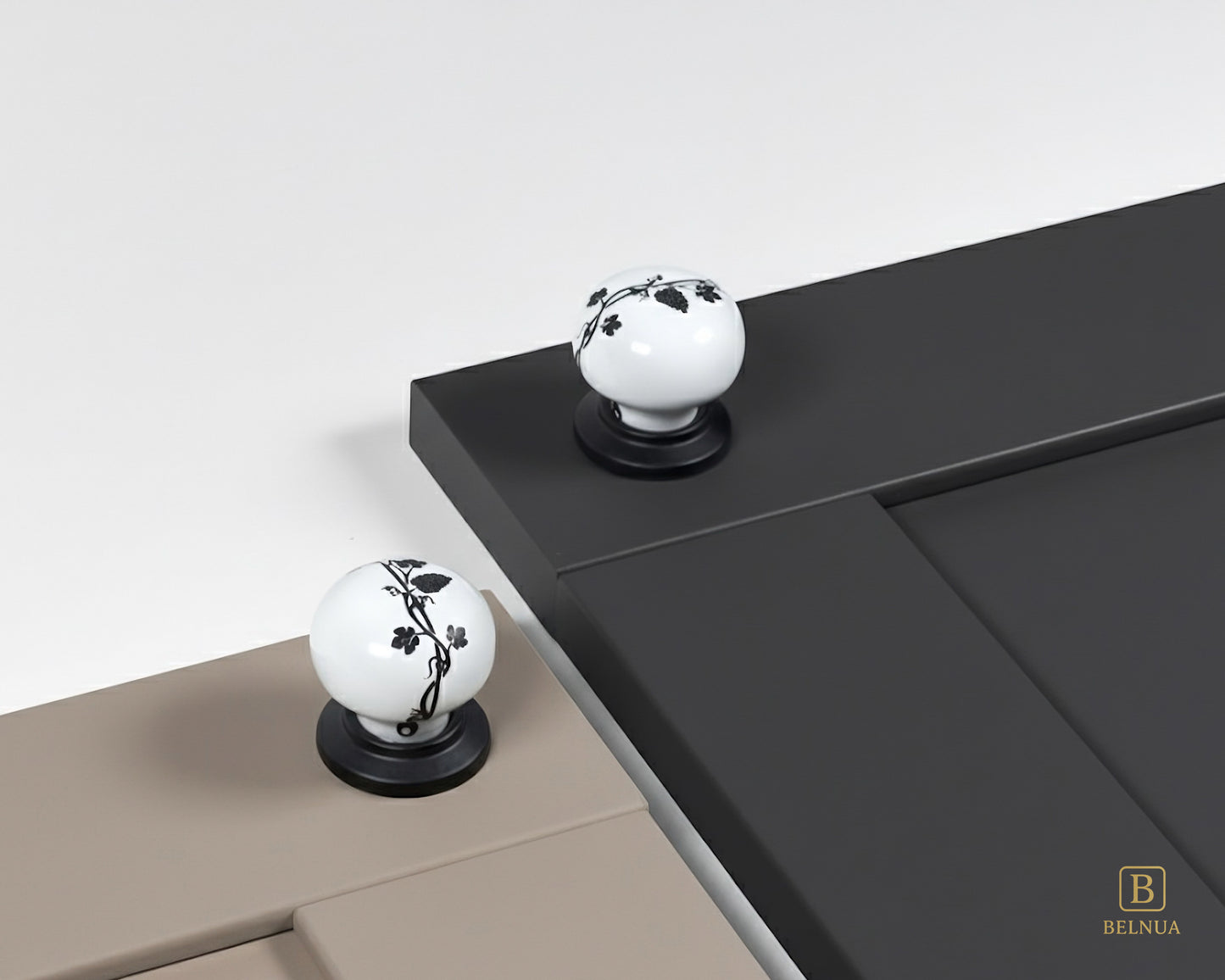 Belnua - Styled cashmere and charcoal grey cabinet door featuring ZERRA black leaf porcelain knob