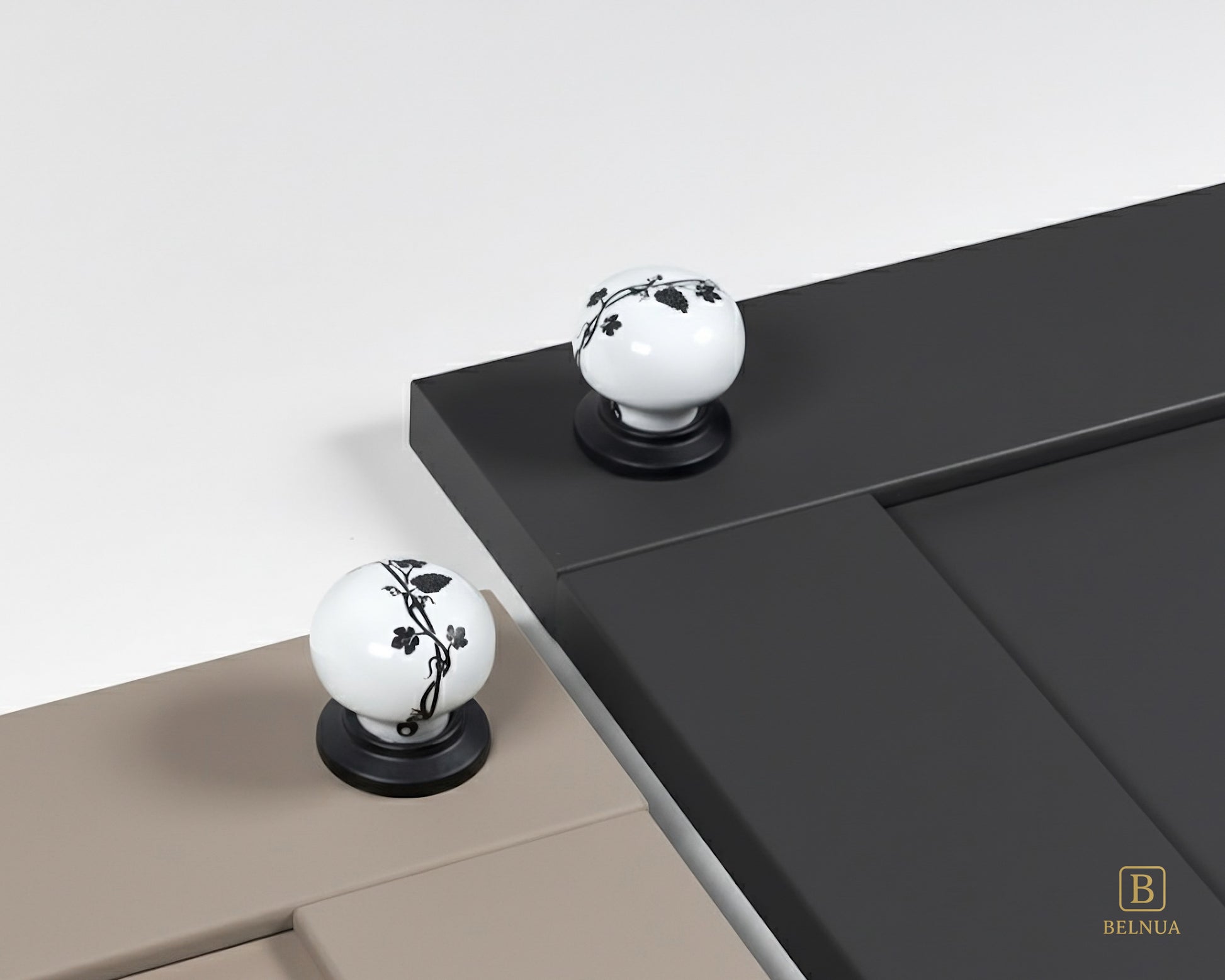 Belnua - Styled cashmere and charcoal grey cabinet door featuring ZERRA black leaf porcelain knob