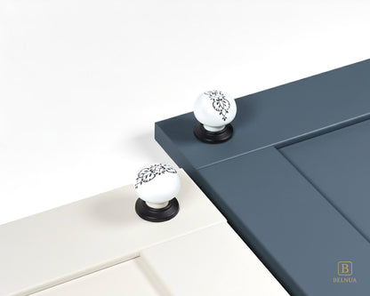 Belnua - ZERRA porcelain/ceramic white knob with ink petal motif on cream & navy blue cabinet door