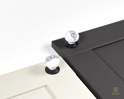 Belnua - ZERRA porcelain/ceramic knob with ink petal motif on porcelain white & charcoal grey cabinet door