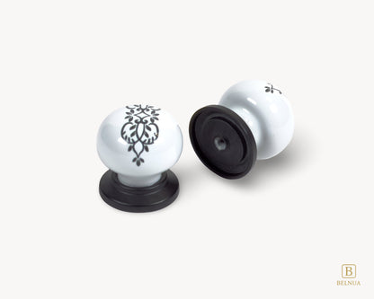 Belnua - Top and back view of delicate ZERRA floral ink pattern on white porcelain knob with matte black base