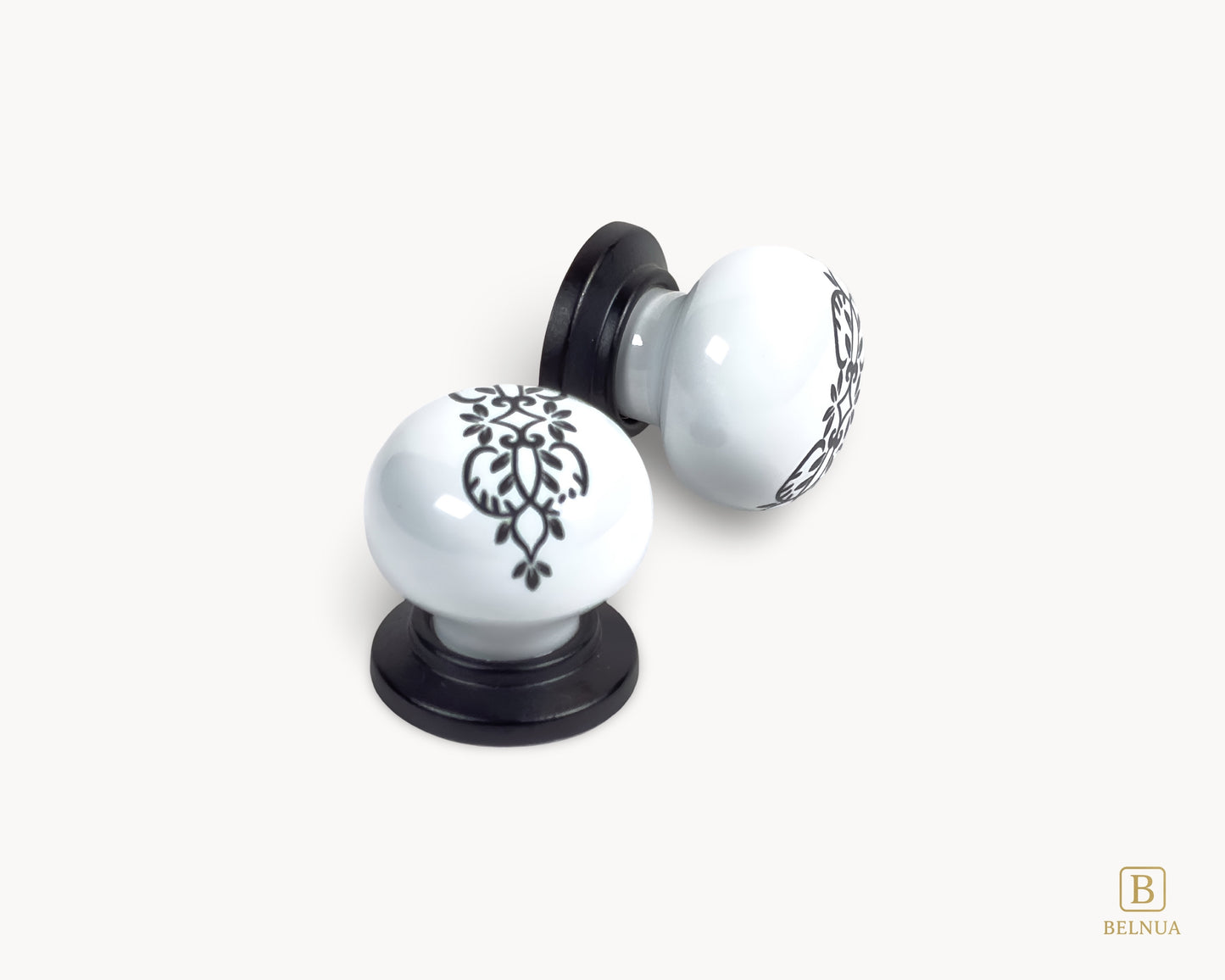 Belnua - Detail of delicate ZERRA floral ink pattern on white porcelain knob with matte black base