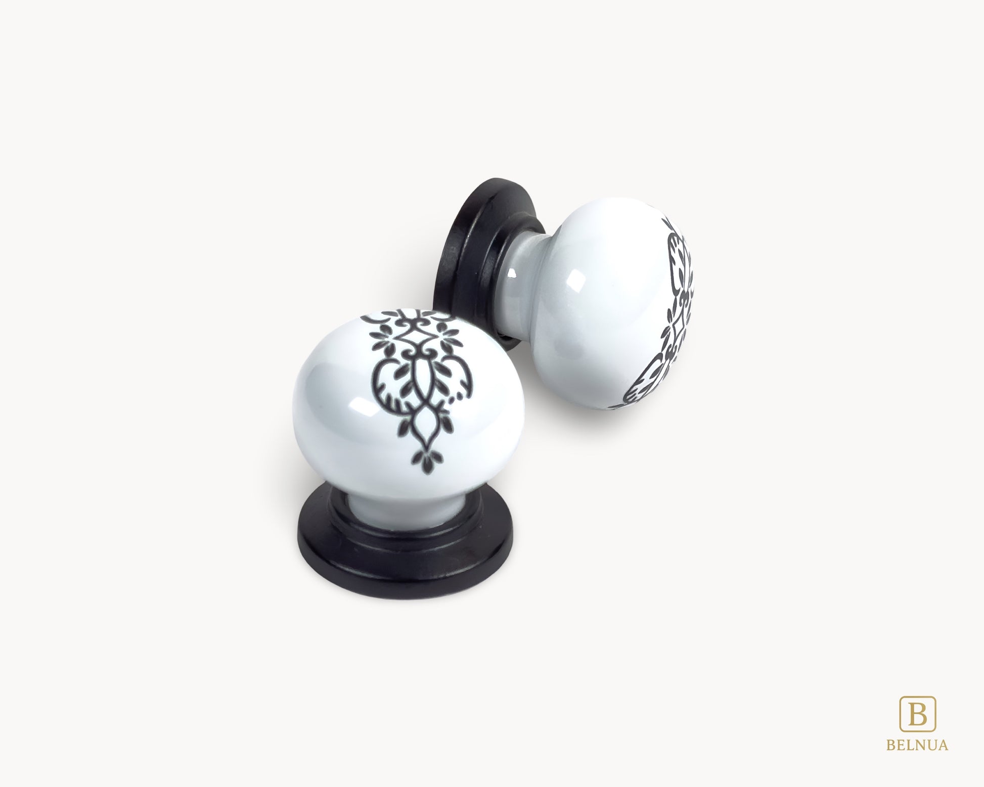 Belnua - Detail of delicate ZERRA floral ink pattern on white porcelain knob with matte black base